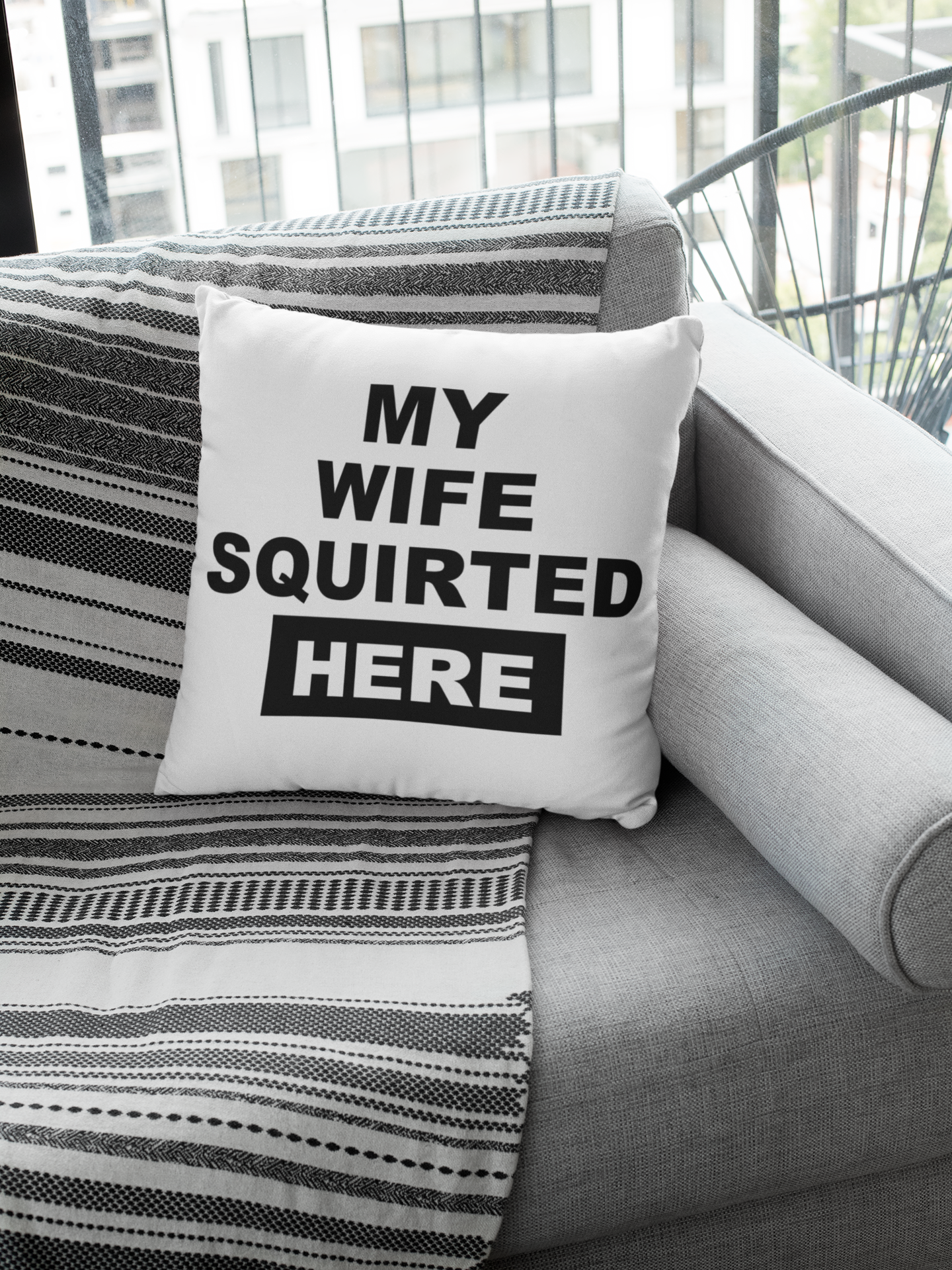 White cushion cover with the funny quote 'my wife squirted here'. Cover only, Zip fastener and printed one side